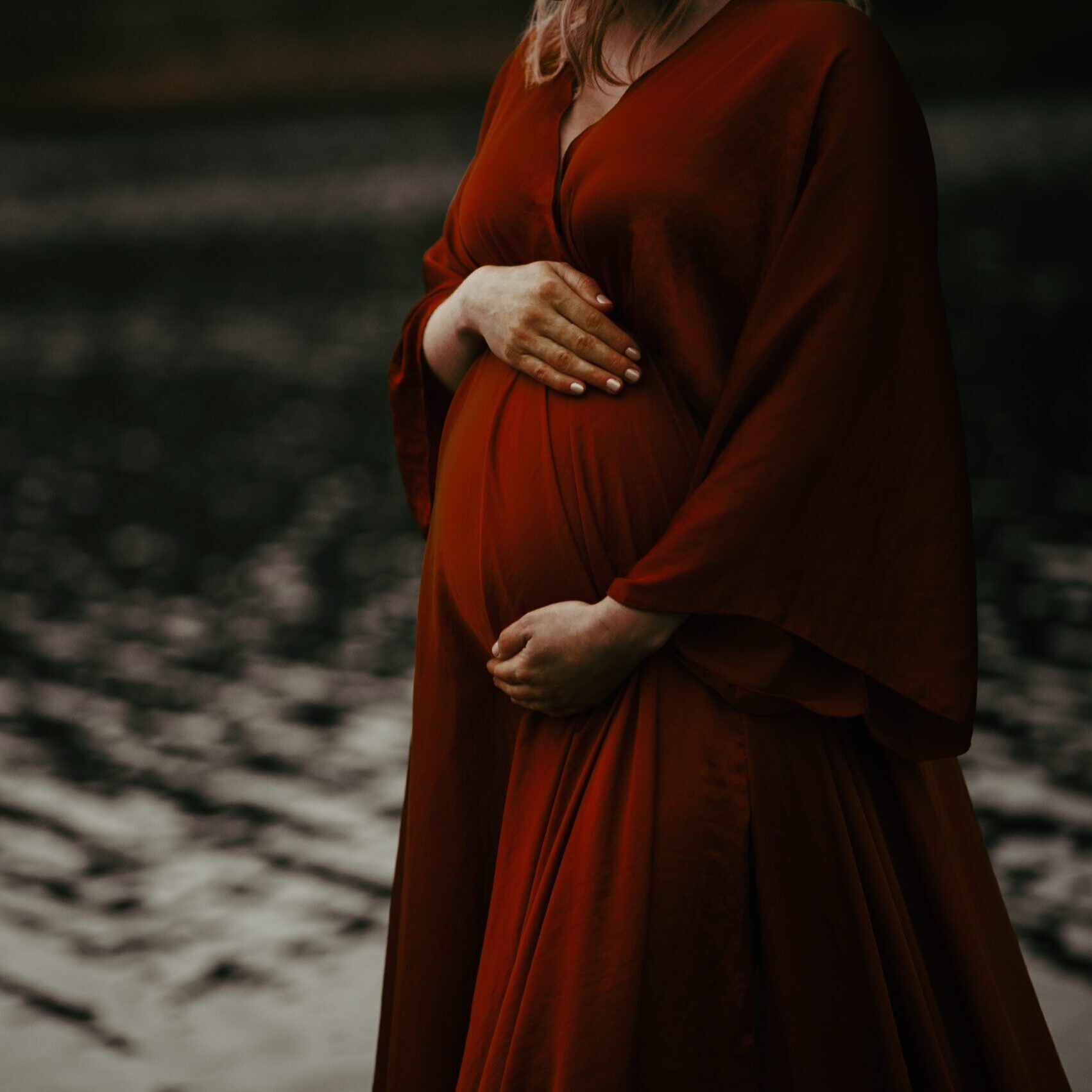 Woman,In,A,Beautiful,Red,Maternity,Evening,Dress,By,The